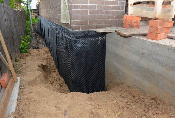 SJ Waterproofing Pros technician performing targeted Exterior Waterproofing assessment in Calhoun, GA